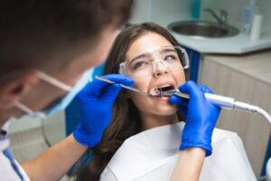 Woman receiving dental treatment and seems totally calm
